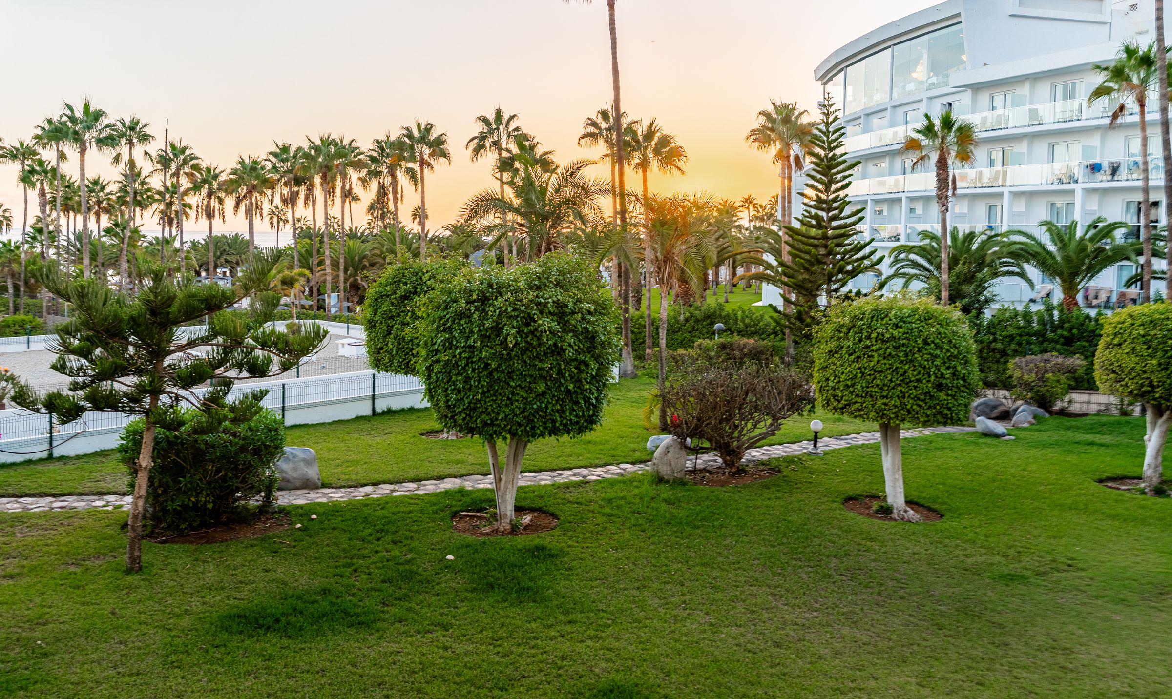 Sunset over the tropical gardens of Altamira, seen from the apartment terrace